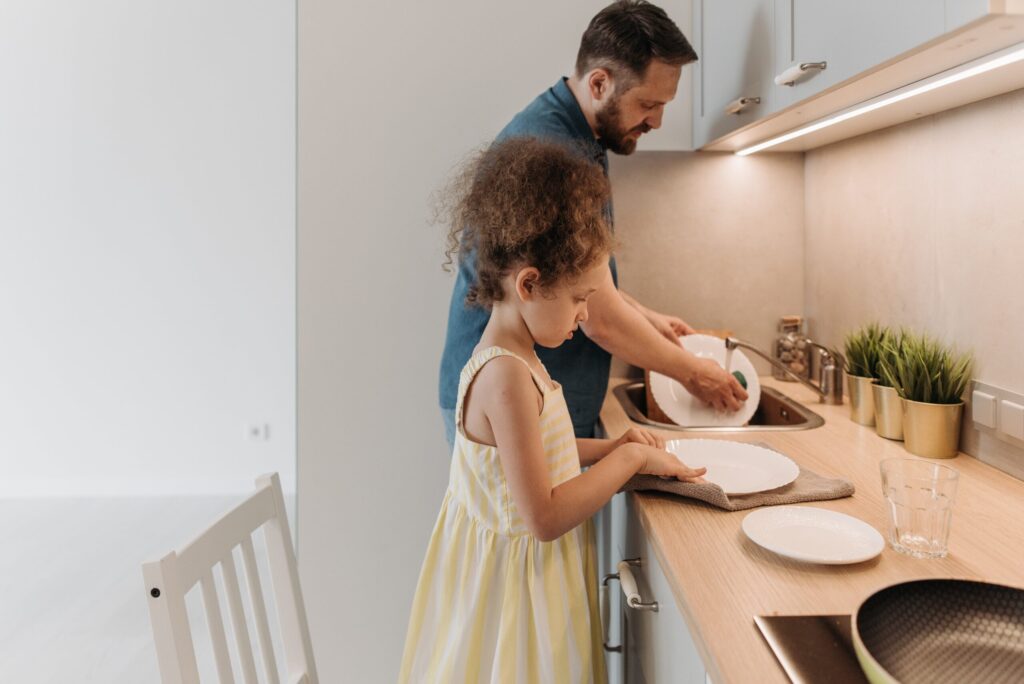 Father and Daughter in Salt Lake City deep cleaning their kitchen