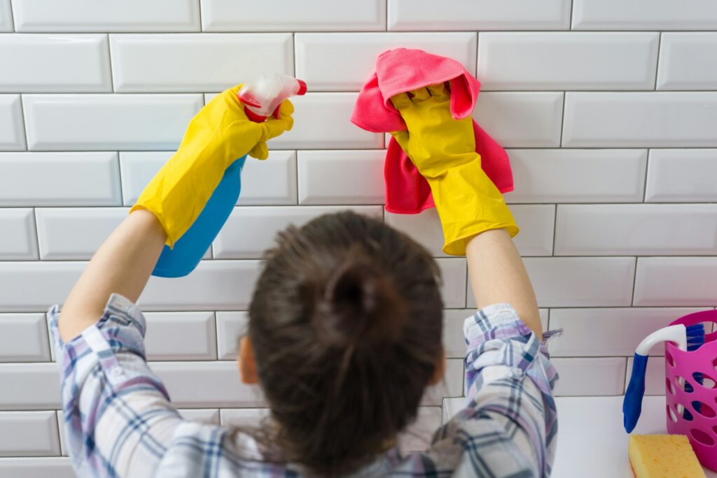 House cleaning. Woman is cleaning in the bathroom at home