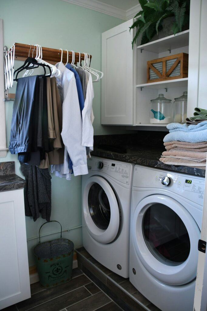 Modern laundry room in a home. Doing the wash in the laundry room at home