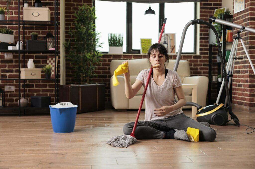 Woman eating a snack while doing deep spring cleaning