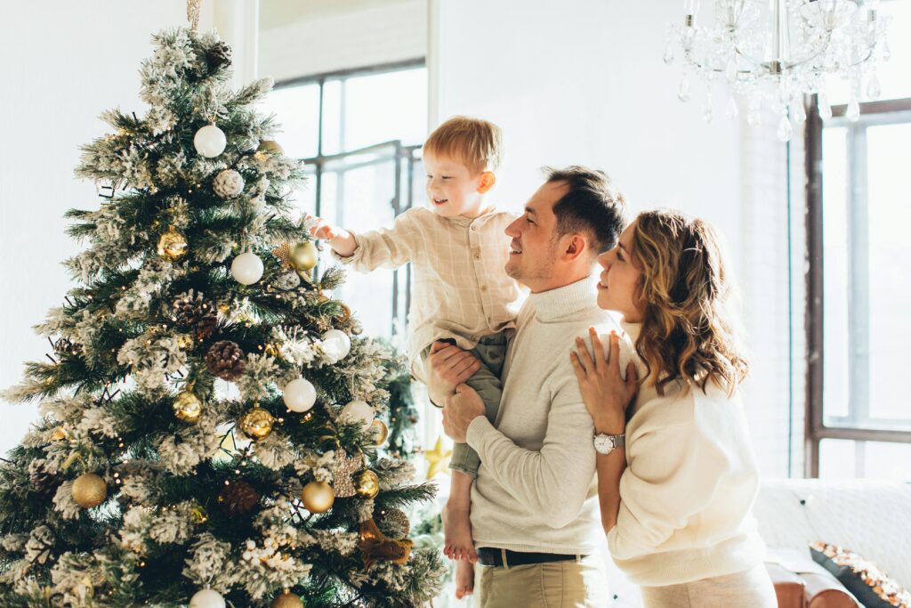 Family Decorating a Christmas Tree