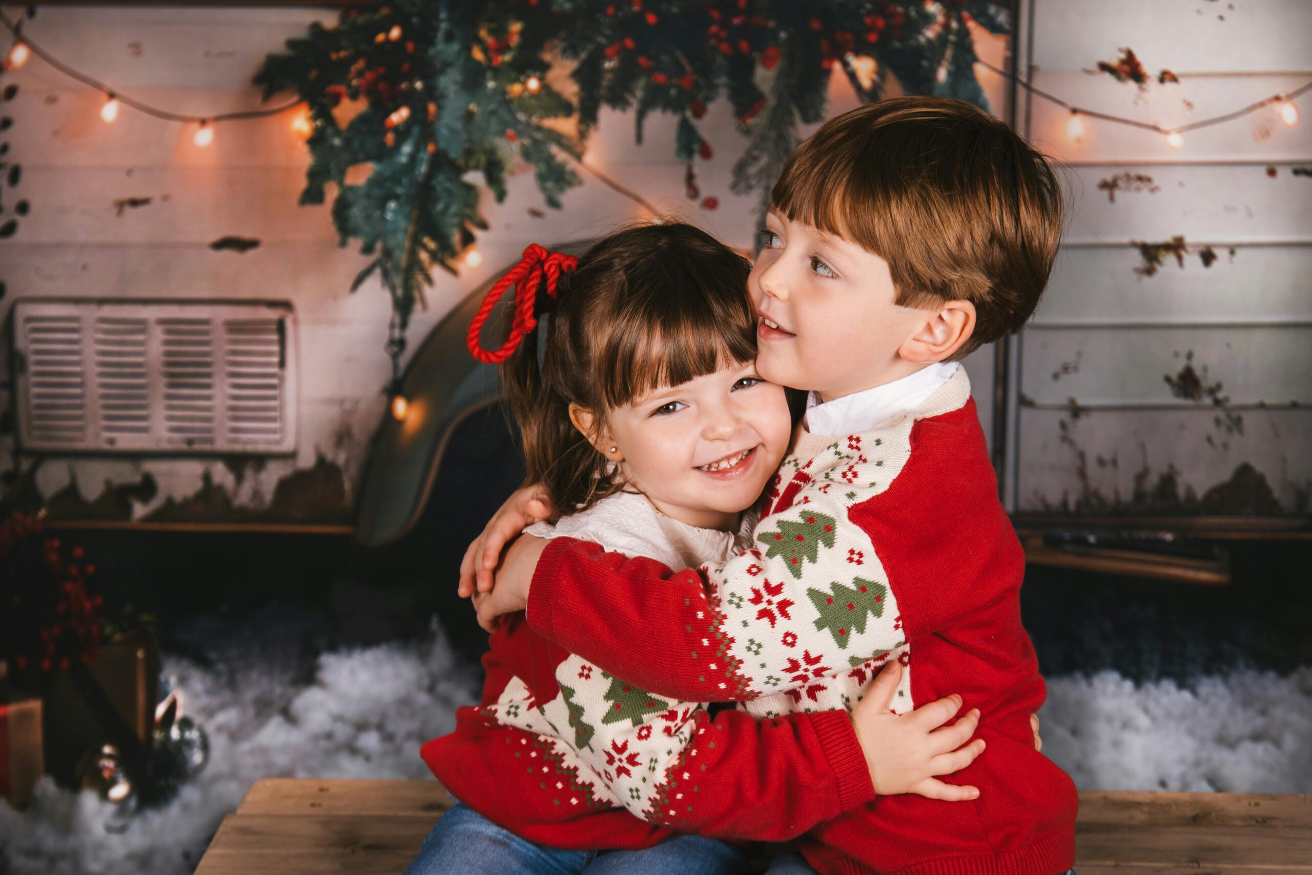 Children hugging celebrating christmas