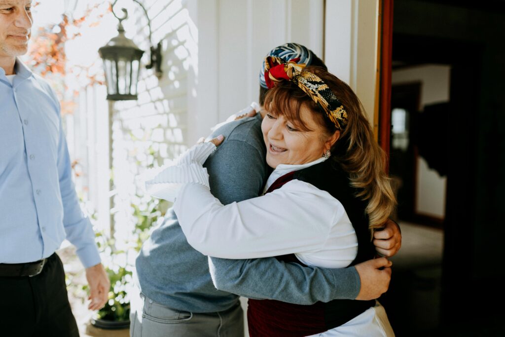 Woman hugging holiday guest