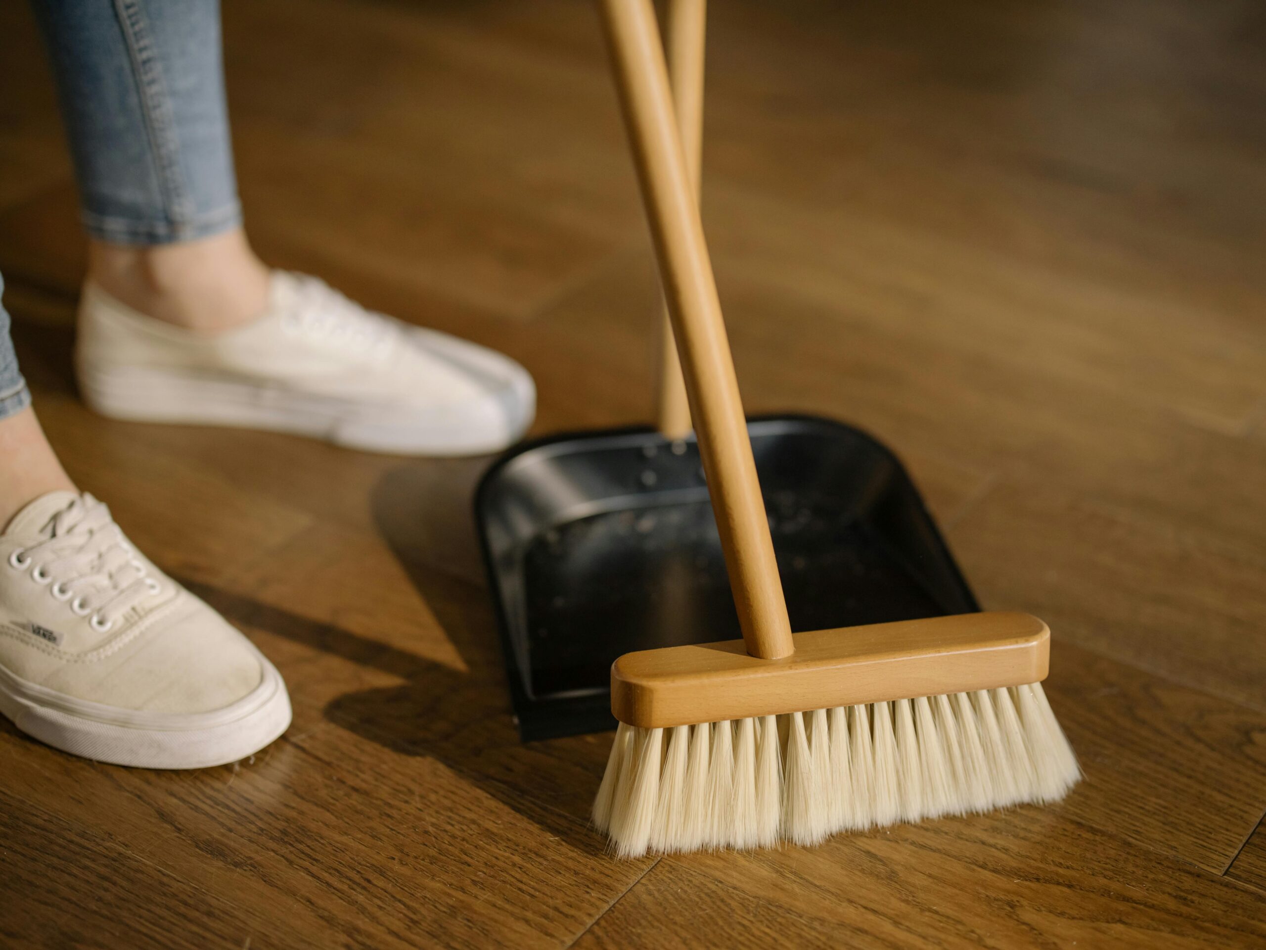 House cleaner sweeping the floor